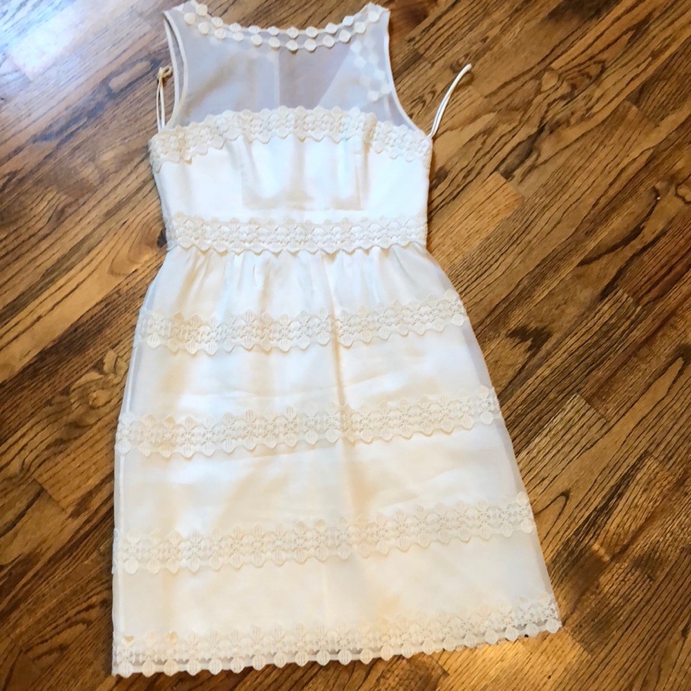 Cream dress with embroidery detail